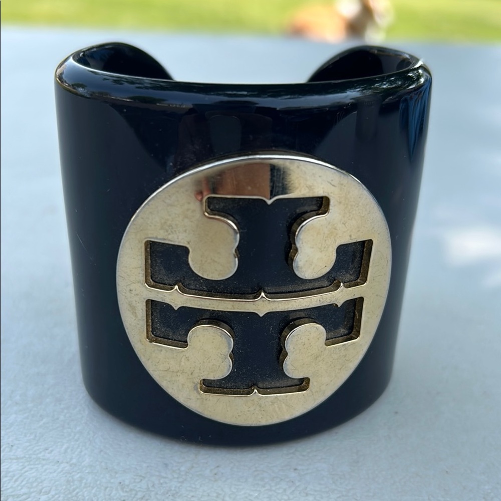 Tory Burch Black Cuff with Gold Emblem and resin